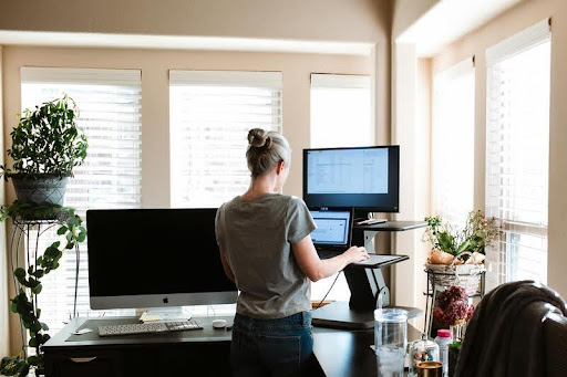 Woman using her computer at a desk