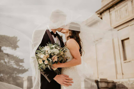 Bride and groom sharing a kiss during their wedding ceremony