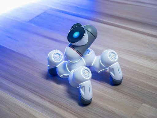 White robot toy navigating a home environment
