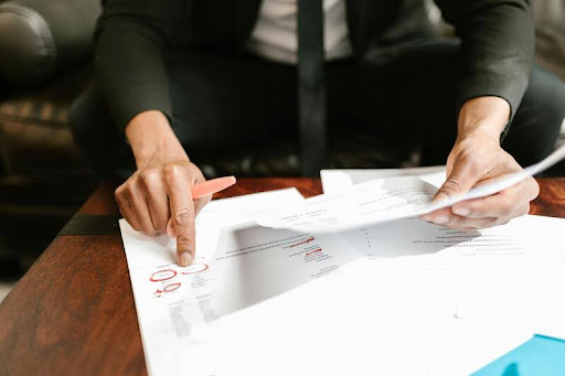 Woman reviewing tax documents at a table