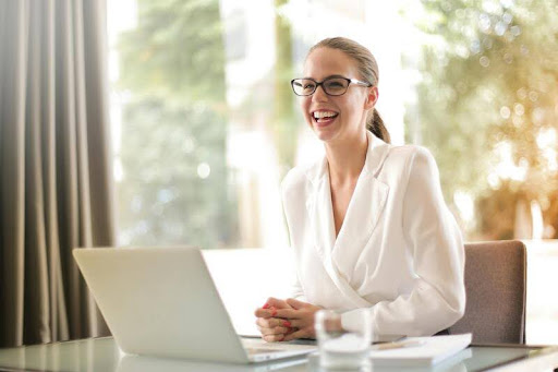 Woman working on a laptop at a desk