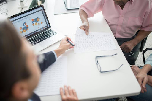 Man and woman having a conversation in an office setting