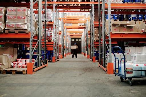 Person organizing inventory in a warehouse