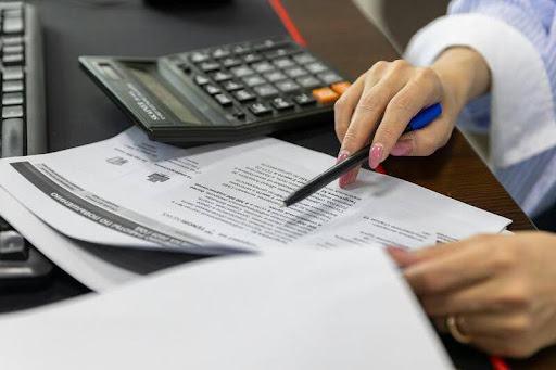 Woman filling out a form at a desk