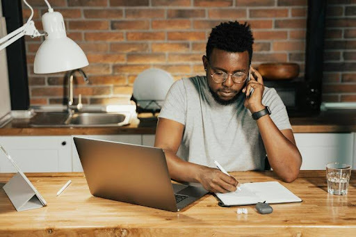 Man working at a desk in a dedicated home office space