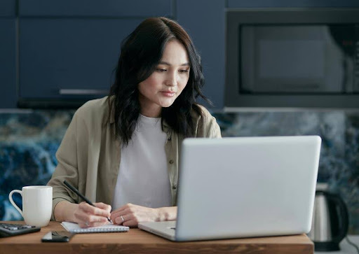 Woman using a laptop at home