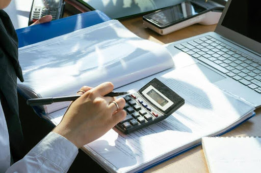 Person reviewing tax documents at a desk
