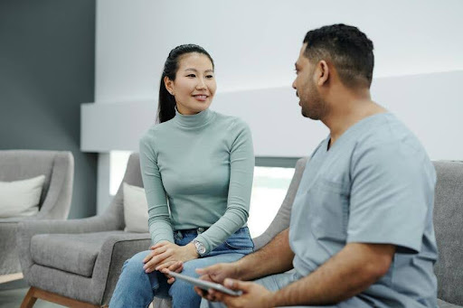 Patient speaking with a doctor during a medical consultation.