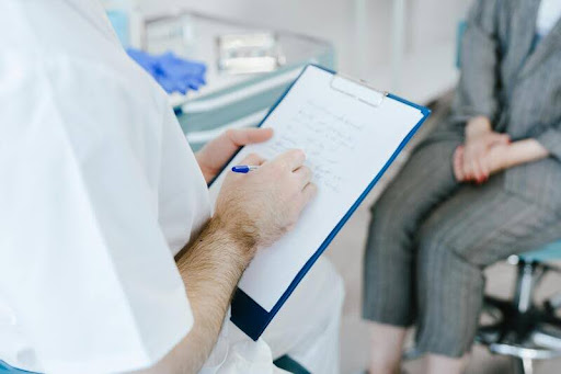 Doctor speaking with a patient during a consultation.