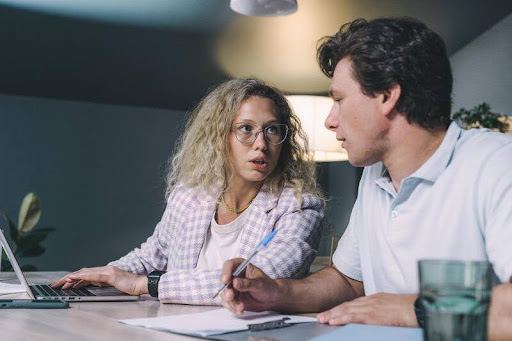Woman talking to a man during a conversation.