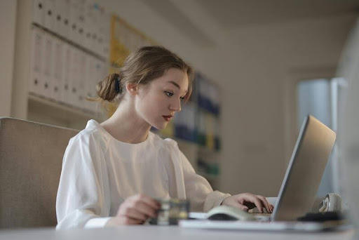 Woman using a laptop at a desk