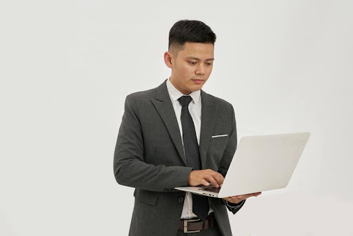 Man using a laptop at a desk