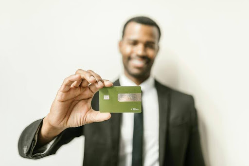 Man holding a credit card in his hand