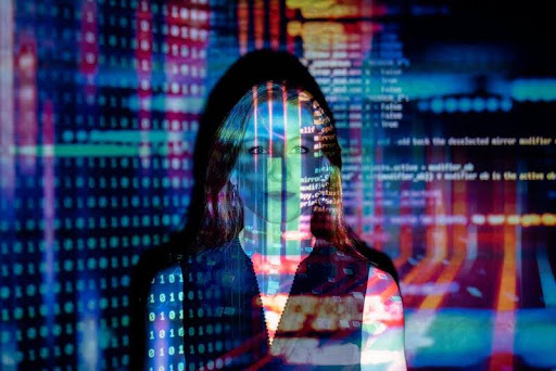 Code projected onto the silhouette of a woman, symbolizing AI and human connection.