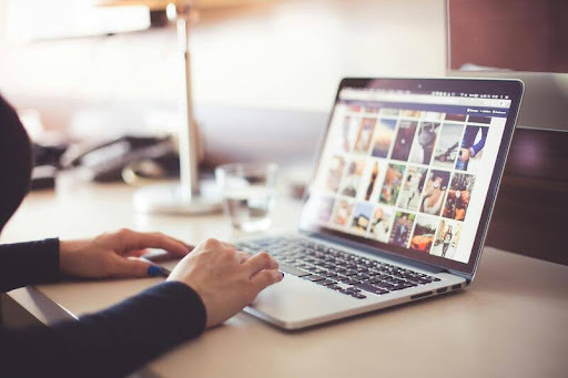 Woman using a laptop to search for information on a search engine.