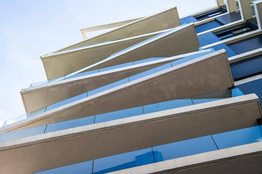 Modern residential building with AI-driven design, sleek minimalist architecture, and luxurious gold, black, and white accents.