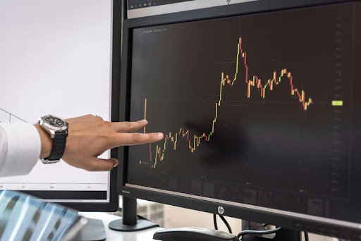 Executive analyzes digital asset charts, optimizing automated trading strategy on a sleek black screen.